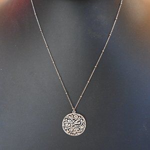 Silver necklace and 2 sets of matching earrings.